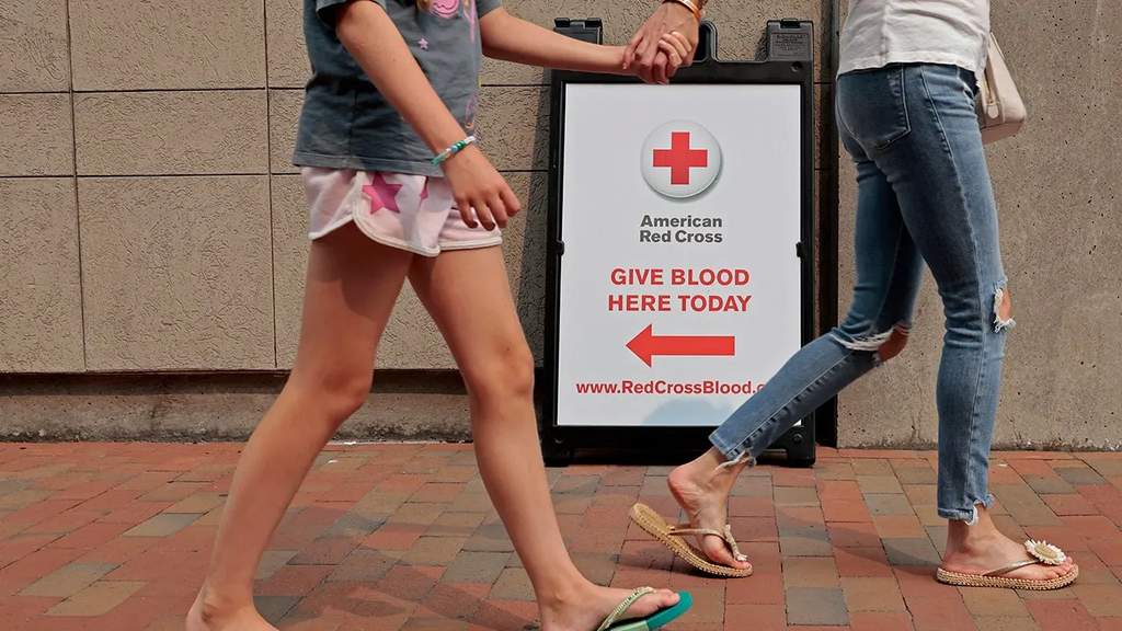A volunteer donating blood at an American Red Cross blood drive