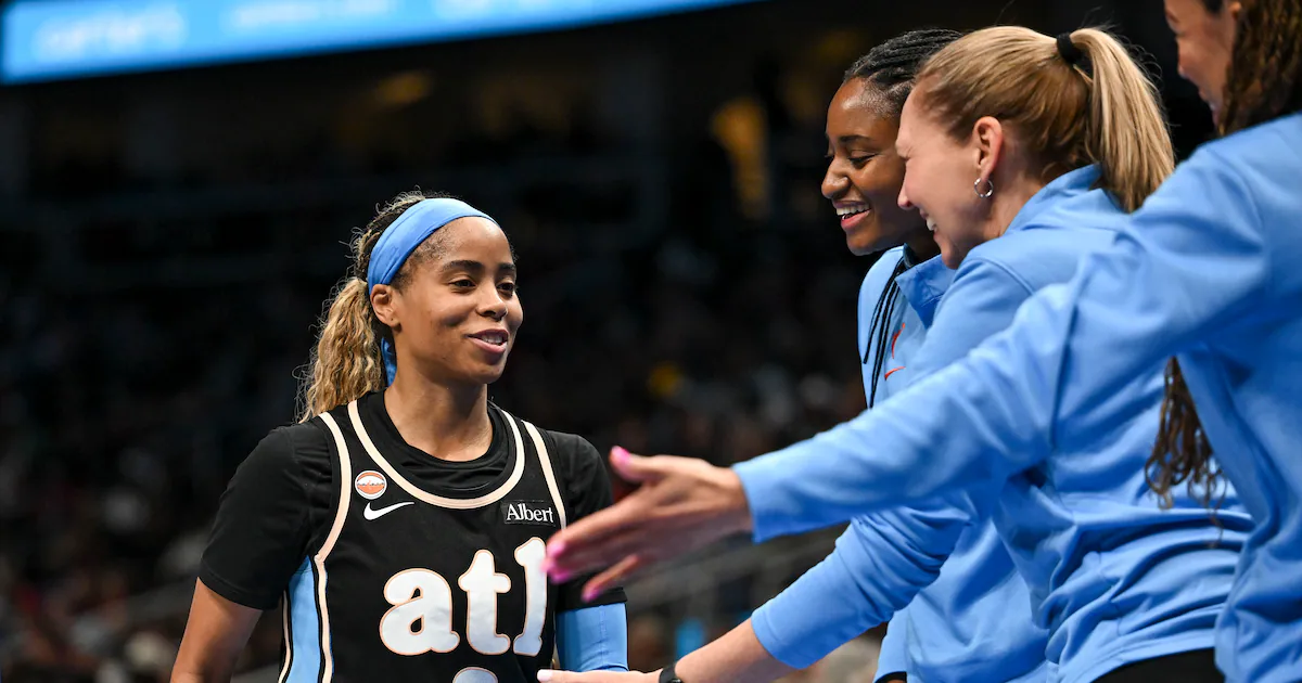 Atlanta Dream guard Jordin Canada dribbling the basketball on the court during a WNBA game