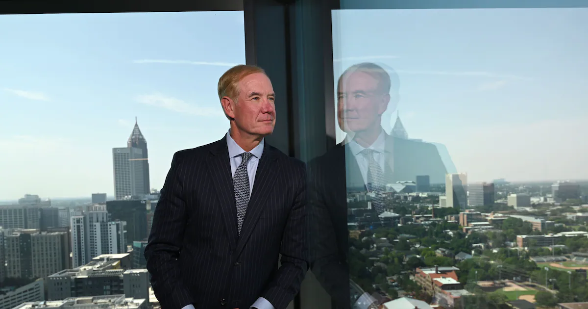 Pinnacle Financial executive overlooking Atlanta skyline