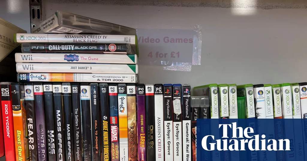 Shelves filled with various secondhand video game cases in a charity store