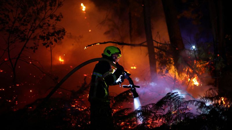 Thick plumes of wildfire smoke darkening the sky over southwestern Europe