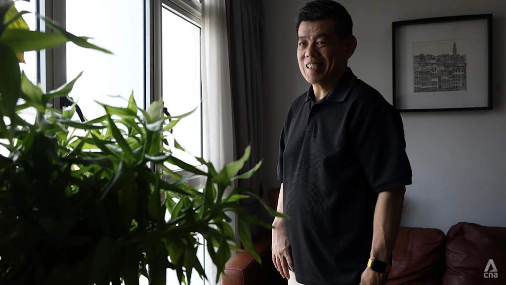 Terence Ang working at his home desk