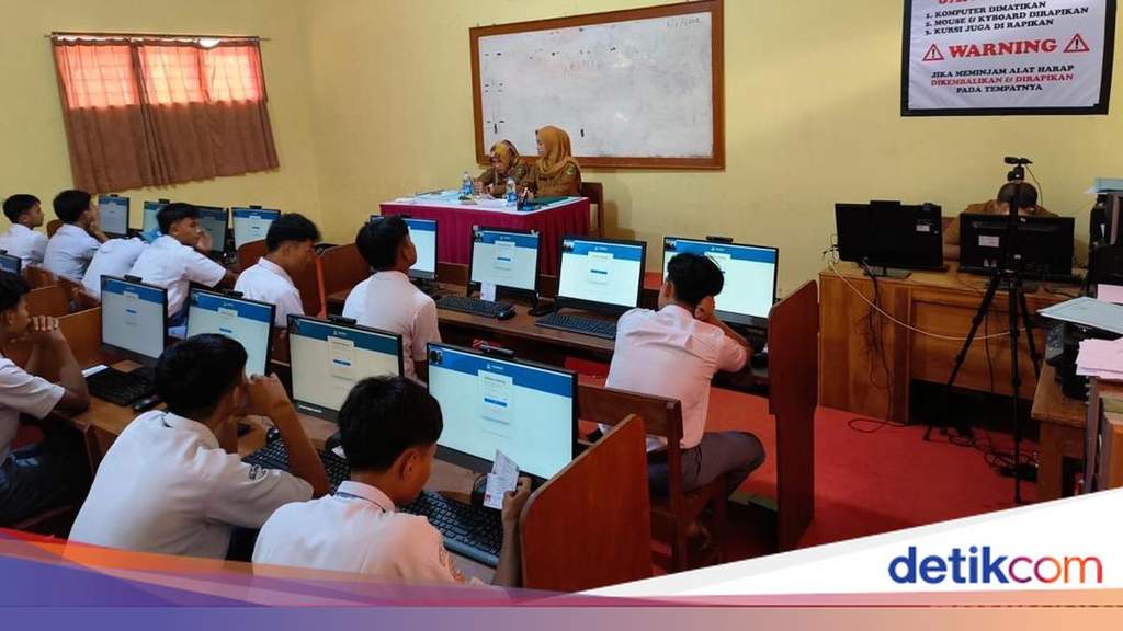 Students participating in educational assessment programs inside a modern classroom