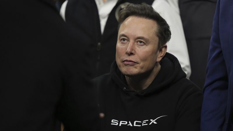 Elon Musk speaking at a technology event