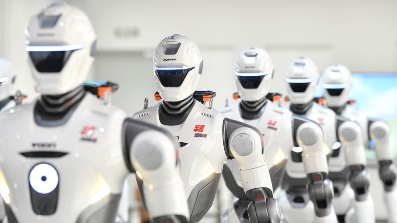 Advanced humanoid robot standing in a modern technology laboratory