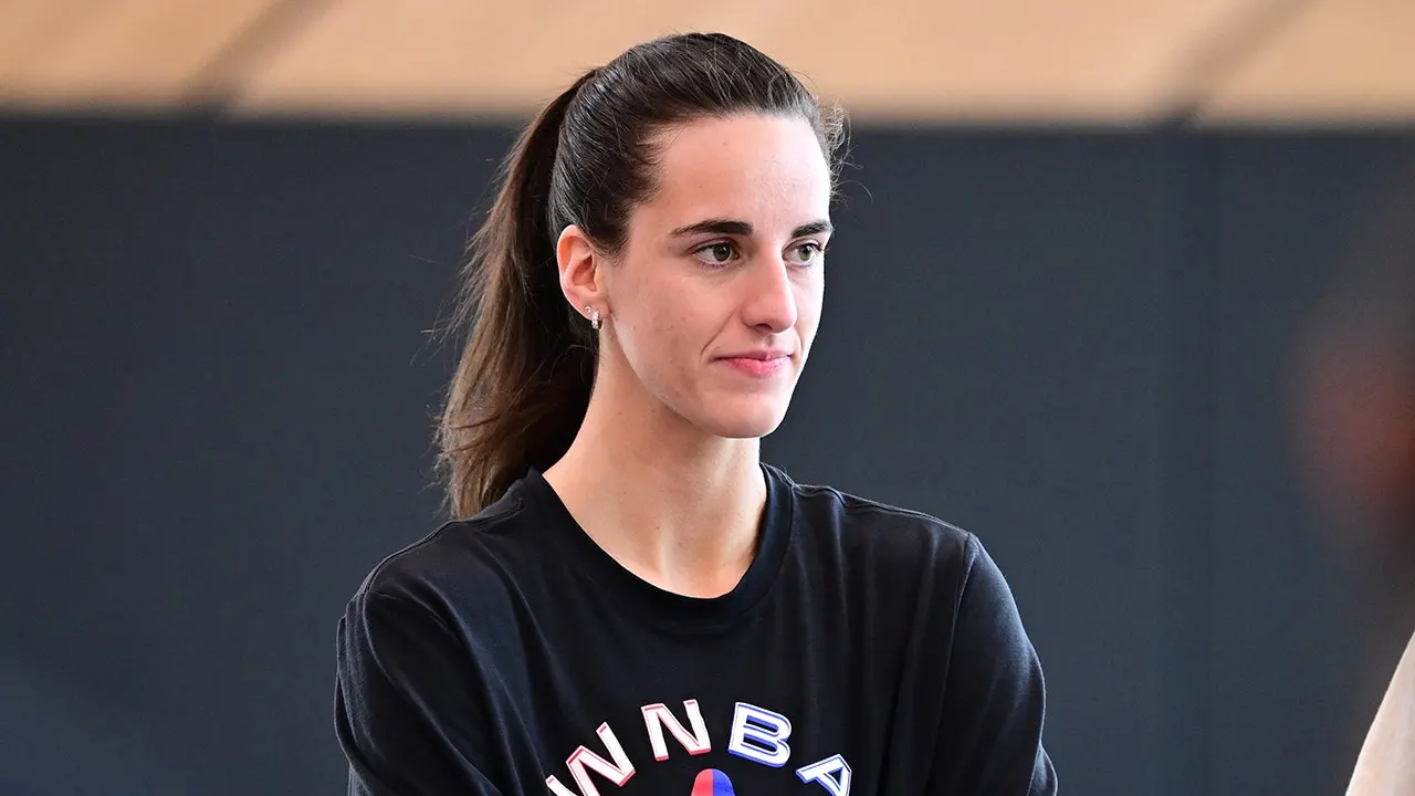 WNBA star Caitlin Clark addressing the media after a basketball game